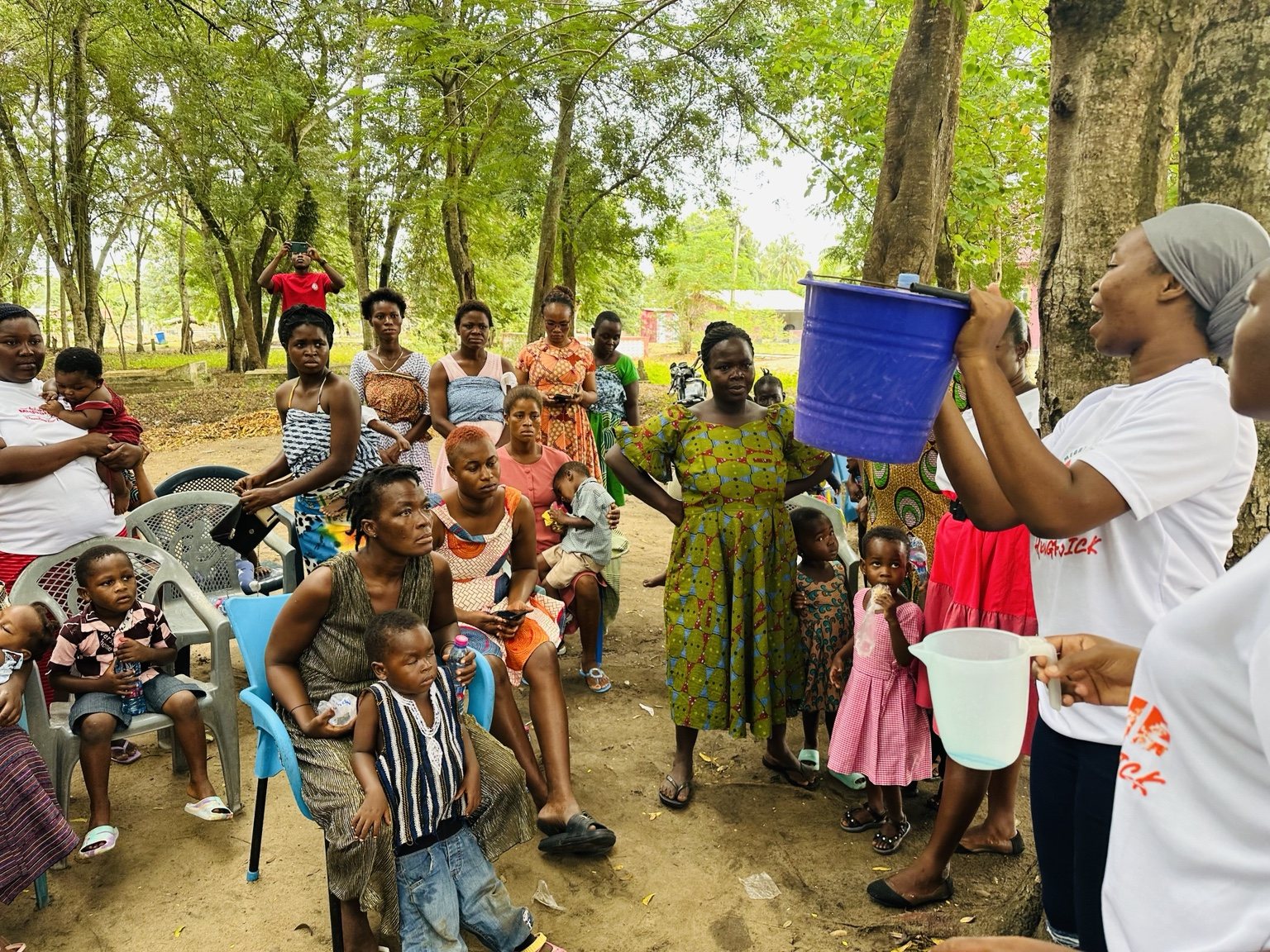 Comfort Legacy Foundation facilitator demonstrating a household preparation method to community participants