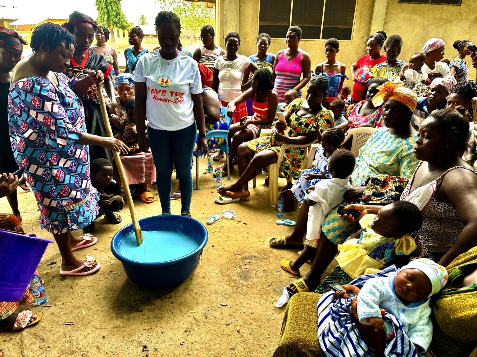 Community participants observing a practical demonstration led by Comfort Legacy Foundation volunteers