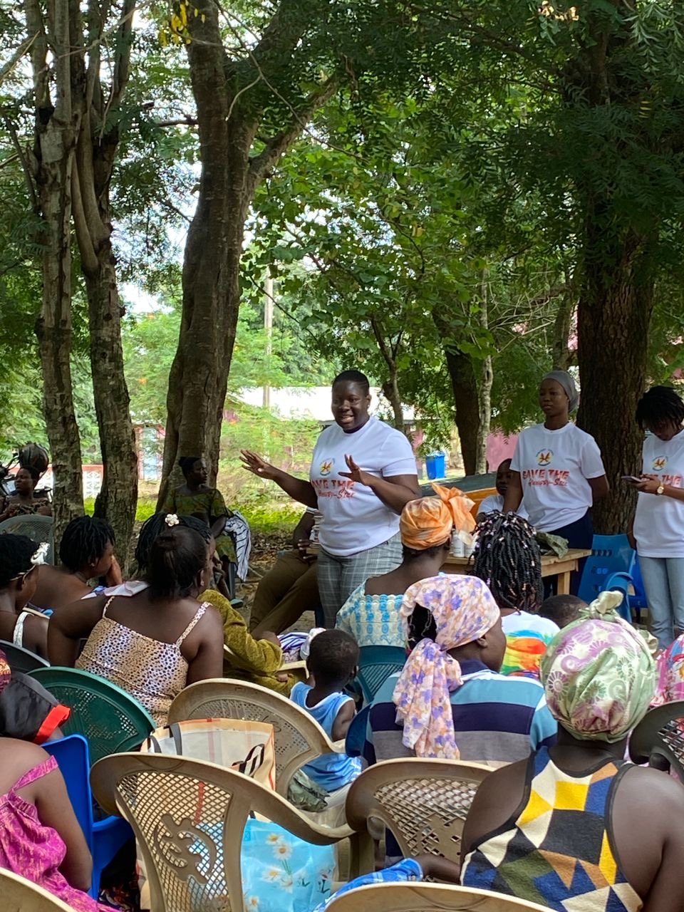 Comfort Legacy Foundation volunteers engaging a large community audience during an outdoor session