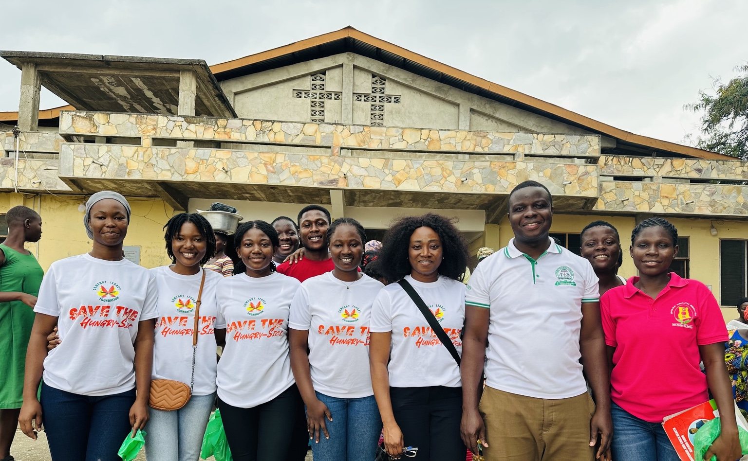 Comfort Legacy Foundation team members and collaborators standing together after a community outreach activity