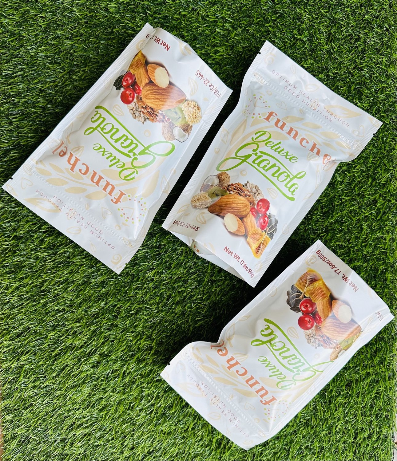 Funchel Deluxe Granola products arranged on a green surface